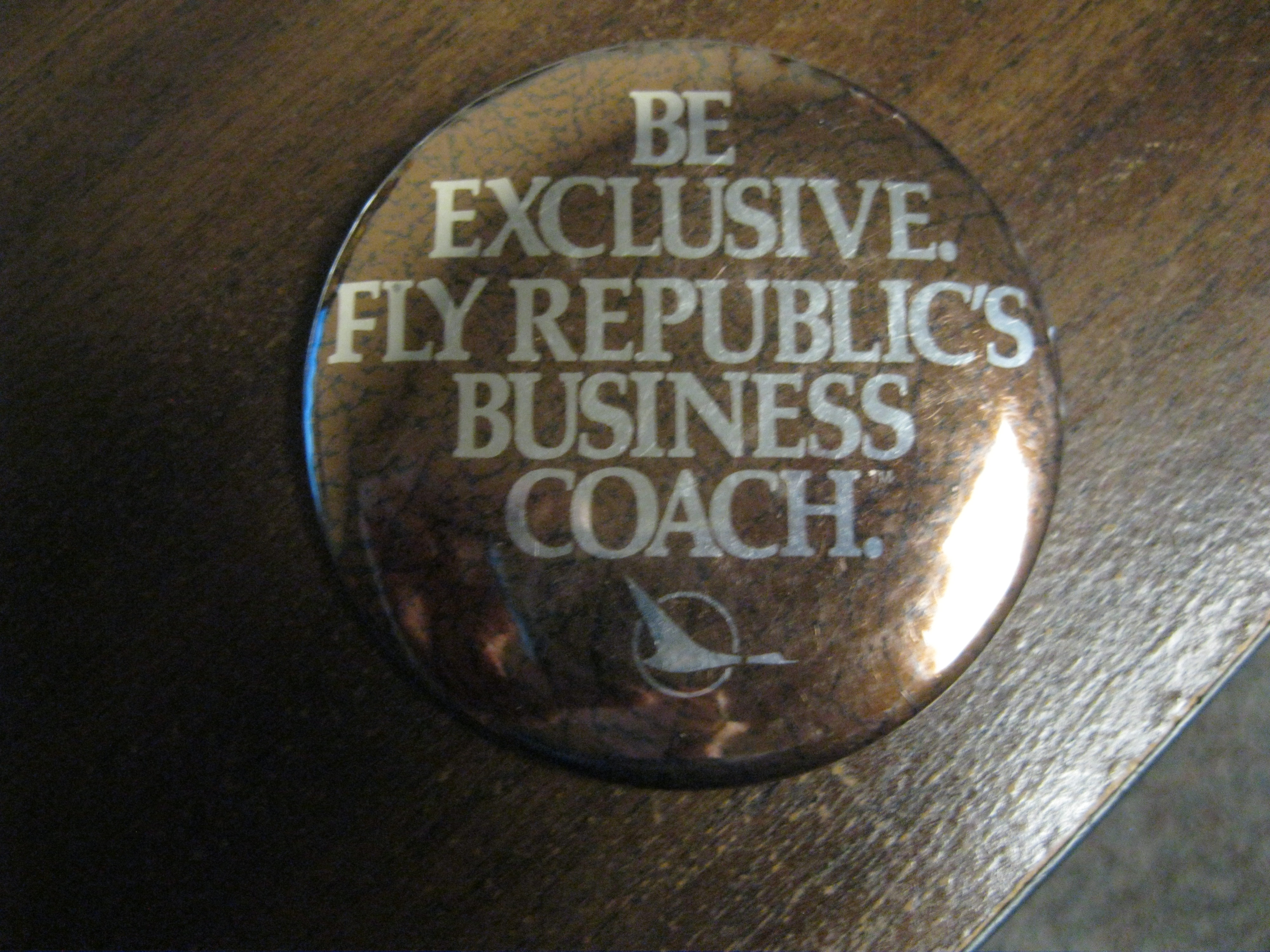 Be exclusive fly Republic's business coach pin back button